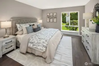 Oversized primary bedroom staged with king-sized bed