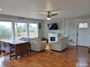 Living Area w// a door to the Side and Rear Decks.