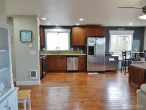Open Great Room w/ gorgeous hardwood floors.