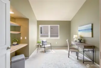 The sunny office/den enjoys a built-in work area handy for work or play.