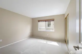 The spacious second bedroom has a large closet and is perfect for guests or hobbies.