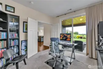 Main floor den or bedroom with door to patio