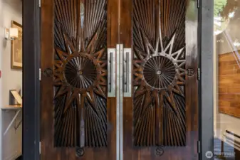 Beautiful Mid-Century Carved doors welcome you home.