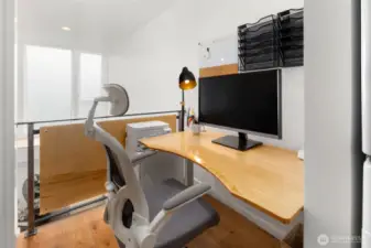 2nd floor desk area adjacent to washer/dryer in wide hallway
