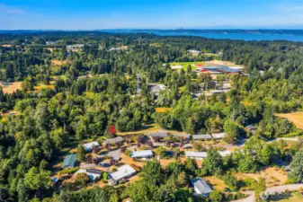 Another aerial view of the neighborhood with the school campuses just off to the northeast. Town is another few minutes north and the buses go by regularly.