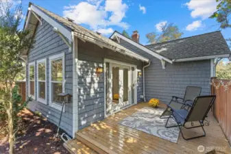 This deck is private and comfortable...steps down lead to a large fully fenced backyard