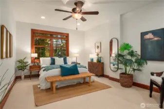This main level bedroom retreat features soft natural tones, wood accents and courtyard views.