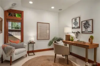 Inviting home office or flex space offering a stylish and calming environment for work or relaxation.