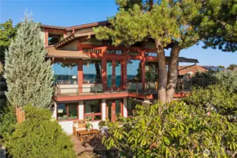 Surrounded by mature landscaping and framed by evergreens, the home seamlessly blends indoor and outdoor living - you will love it here!