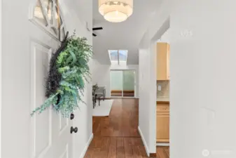 Front entry takes you to a vaulted living room - tons of light and updated flooring.