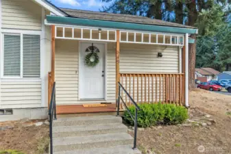 Gorgeous front door and front patio - with fresh paint and new modern railings.