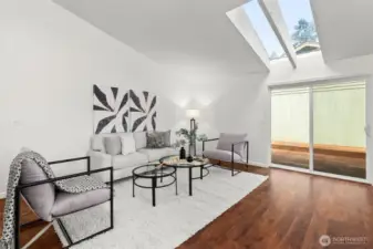 Vaulted living room, with stunning skylights.