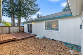 Exterior, fully fenced backyard. The perfect spot for morning coffee and starting that raised bed garden you have always wanted.
