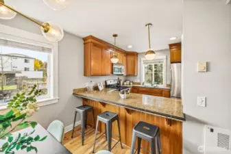 Additional eating space with breakfast bar overlooking kitchen.
