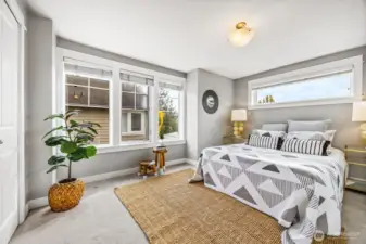 Primary bedrooms flooded with natural light.