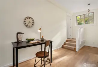 Great spot for a desk or even a love seat in the primary bedroom. En suite bath is up the stairs through the door on left.