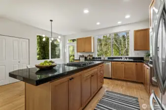 Well-appointed kitchen featuring ample cabinetry, generous counter space, and gas cooking.