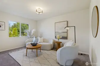 Dedicated seating area within the primary suite adds comfort and versatility.