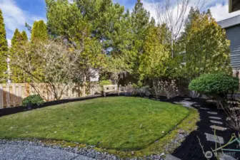 Thoughtfully designed garden that comes alive with blooms in late spring and summer.