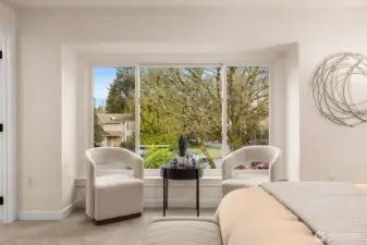 Large windows in the primary bedroom bring natural light