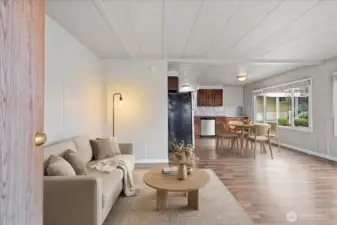 virtually staged living area from secondary entrance