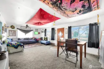 Large combined space for living room and dining room together.