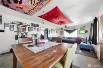 Large cased opening to kitchen.