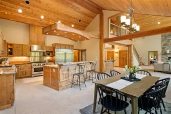 This view shows the incredible wood lined, vaulted ceilings and the openness of the home The timbers are from trees fallen on this property, as are the beams.