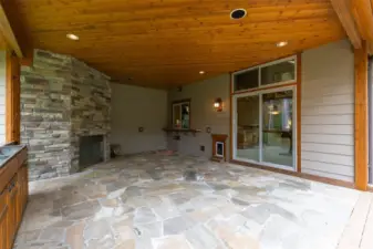 This is the covered BBQ area with the wood burning fireplace. There is a pass-through and serving area as well as a pet door.