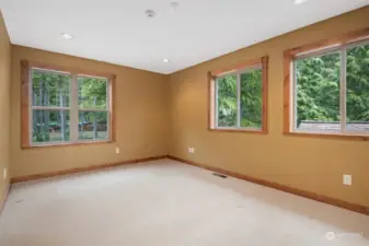 This bedroom is also upstairs and looks out toward the circular driveway. Like all the rooms, it is very spacious!