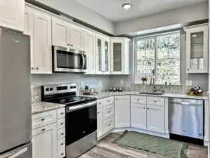 Kitchen with stainless steel appliances and solid wood, soft close cabinets