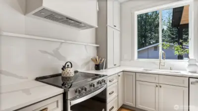 Quartz backsplash and shelving in kitchen