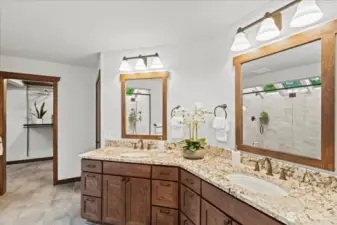 Remodeled primary bathroom in 2016 includes dual vanities, heated floor, solar sun shades, walk-in shower and walk-in closet