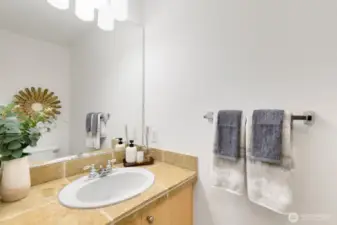 Powder room on main level with new light fixture
