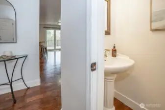 Convenient powder room is centrally located on the main floor.