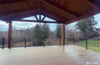 This covered deck spans the entire length of the house. You won’t have to worry about the weather when you hang out on this beauty.