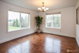 When you choose this home, you get to enjoy time together in the formal dining area with lake and territorial views. The large windows bring in loads of natural light and show off the fresh new paint and trim work.