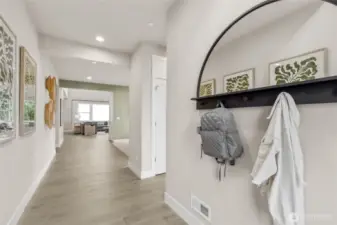 Beautiful deco front door leads you into your new home. Photo is representational. Actual home is under construction and materials, colors, and finishes will vary. See site agent for details.