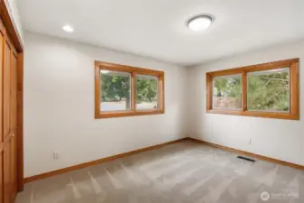 Third bedroom with lake views and beautiful oak trim and pine closet doors.