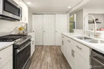 Large pantry storage area at the end of the kitchen. The washer and dryer could also be moved here as it is already plumbed.