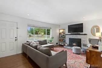 The bright and spacious living room has plenty of space for a large couch and extra furniture.