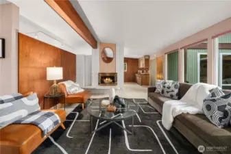 Charming living room with open layout, flooded with natural light and retro character.