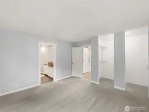 View of the Primary Bedroom to the primary bath /closets and to the main living areas.