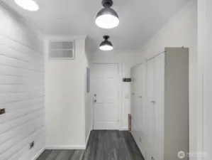Utility room w/ large cabinets for extra storage.