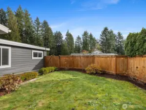 View from backyard-this leads to the front of the home. Double gate with a large concrete walkway.