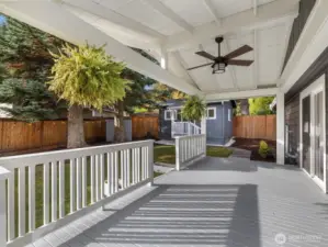 Expansive deck that leads to the spacious fully fenced yard.