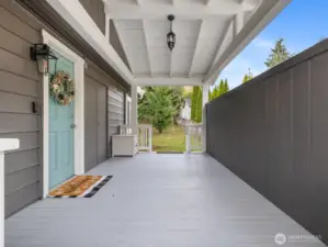 Covered porch, carport side entry to the utility room