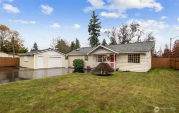 Welcome home!  Detached garage and a wide paved driveway offer plenty of parking for all your needs.
