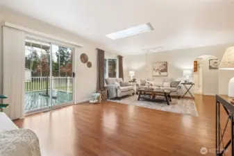 Offering an airy sense of openness, this living space blends comfort with versatility. The spacious main room invites a wide range of seating layouts and functional uses.