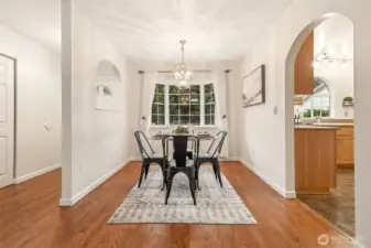 The dining room sits adjacent to both the main living area and the kitchen for seamless convenience and accessibility. A dedicated space for gathering makes everyday meals and entertaining feel effortless.